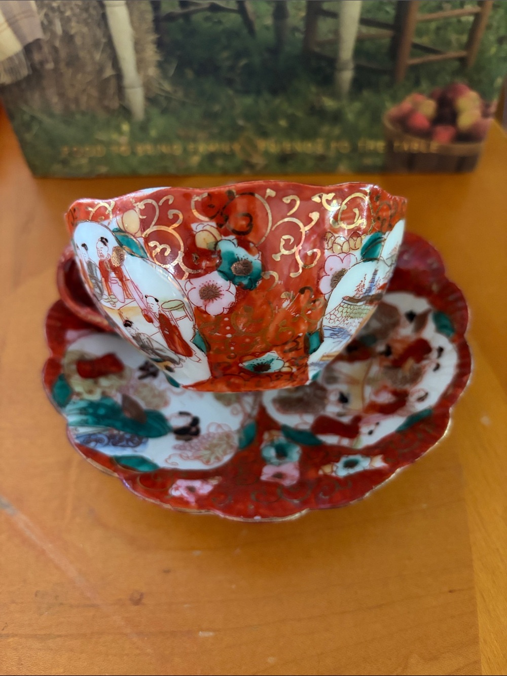 Red and Teal Decorative Porcelain Teacup and Saucer - Brand Unknown